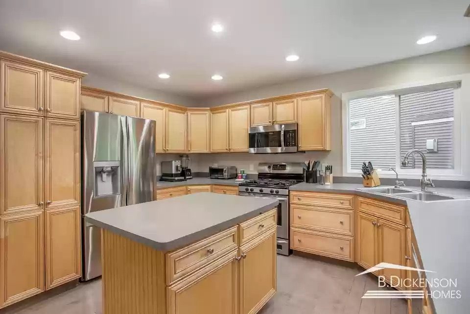 Before photo of kitchen remodel in Grand Rapids with brown cabinets and darker wall colors